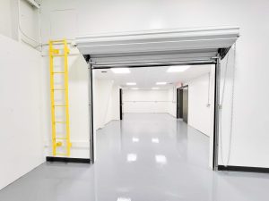 interior warehouse renovation epoxy floors painting door openings