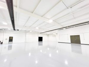 interior warehouse renovation epoxy floors painting door openings